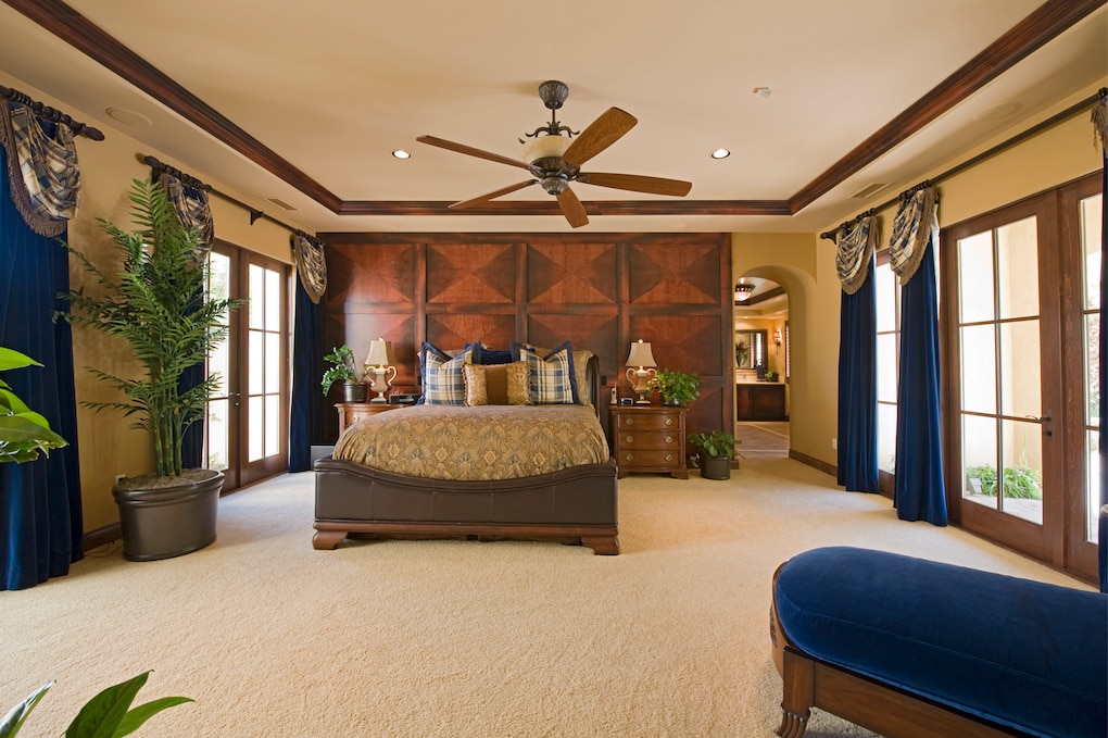 Spacious and luxury bedroom interior with ceiling fan