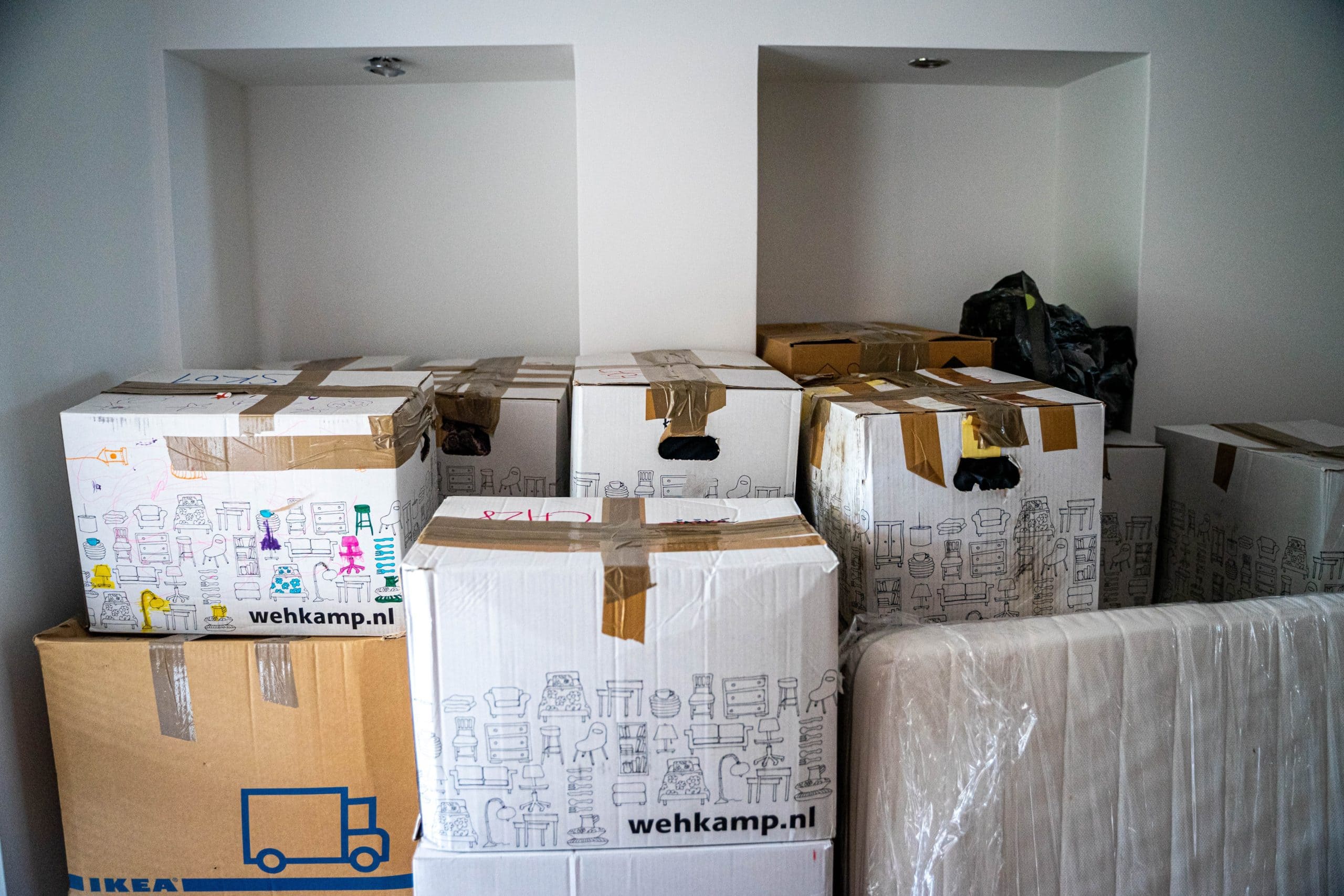 moving boxes stacked in a bedroom