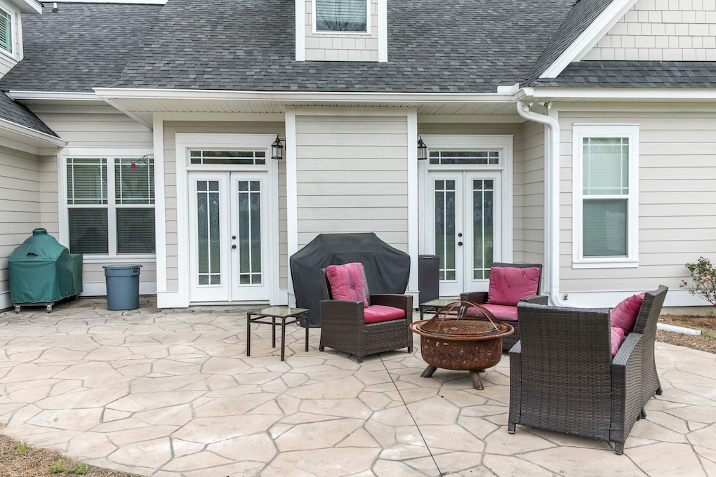 patio with chairs behind the home