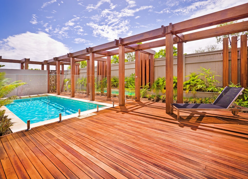 view of pool and redwood deck materials