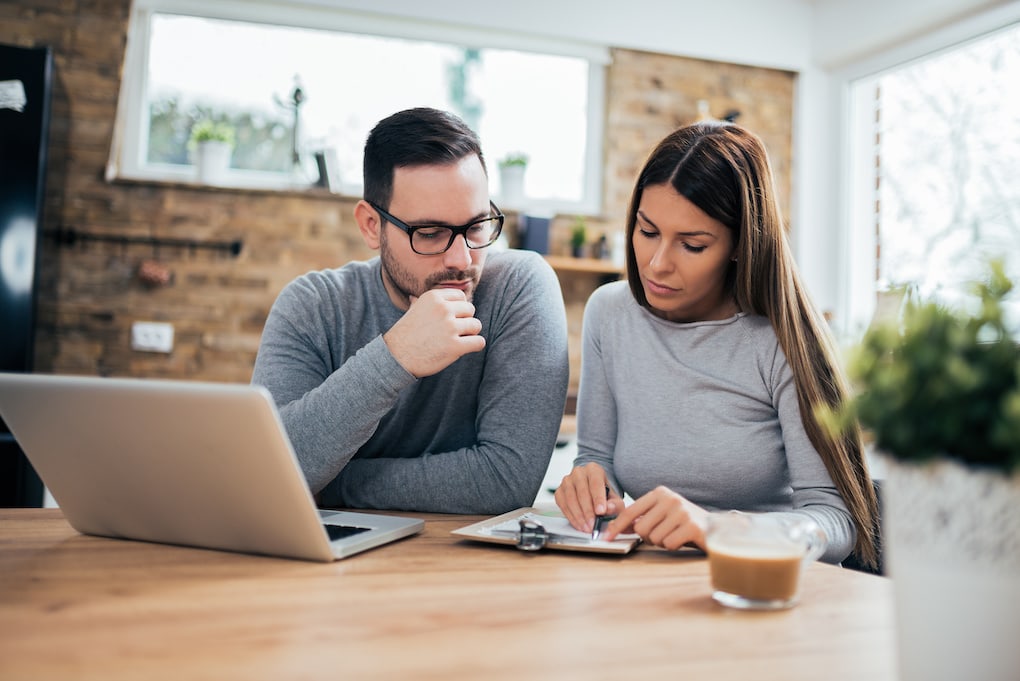 couple analyzing finances before whole home remodel
