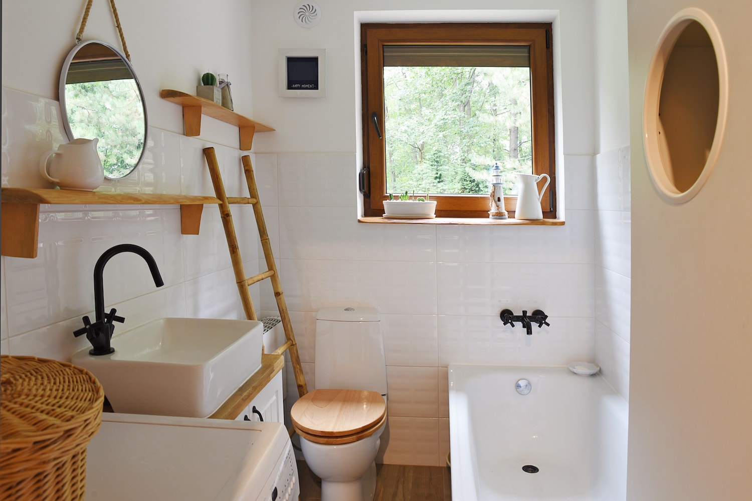 budget small bathroom remodel finished bathroom renovation with warm wood tones and white tile and fixtures