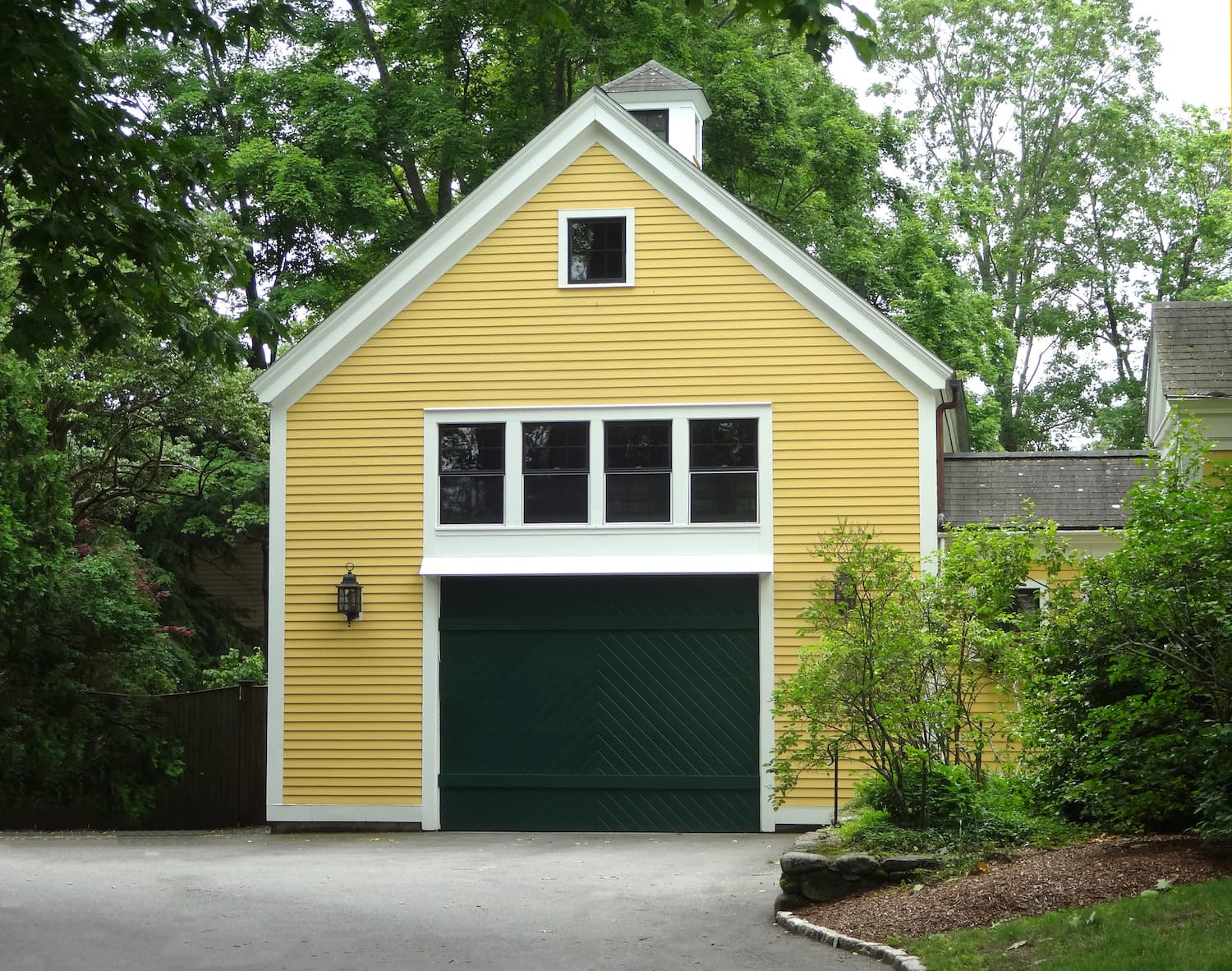 multigenerational homes yellow garage with apartment above